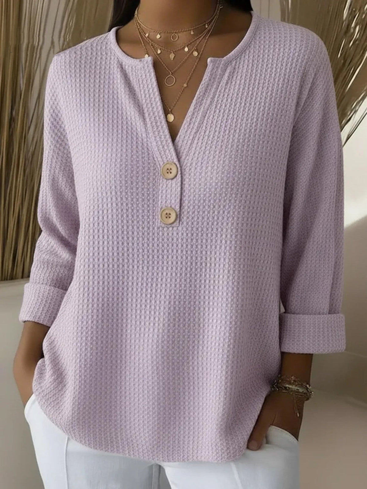 Lucía Maglietta Henley goffrata con bottoni